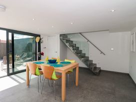 A dining room with a table and chairs at Number 7 in Bishop Sutton