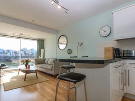 A living room with furniture and a view at 1 Oakley Wharf in Porthmadog