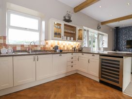 A kitchen with cabinets and countertop at The Gatehouse