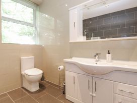 A bathroom with a toilet and sink at The Gatehouse in 