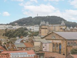 A view of buildings and hills at Launcher's Cottage in Scarborough
