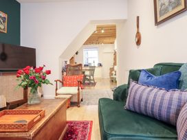 A living room with a sofa and coffee table at Derwen House in Llangollen