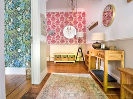 A hallway with a console table and mirror at Rosemount Boutique in Windermere