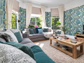 A living room with a sofa and coffee table at Rosemount Boutique in Windermere