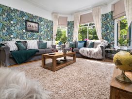 A living room with a sofa and coffee table at Rosemount Boutique in Windermere
