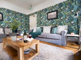 A living room with a sofa and coffee table at Rosemount Boutique in Windermere