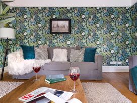 A living room with a sofa and coffee table at Rosemount Boutique in Windermere