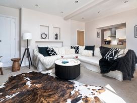 A living room with a sofa and coffee table at Rosemount Boutique in Windermere