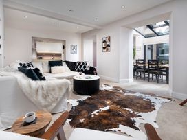 A living room with a sofa and coffee table at Rosemount Boutique in Windermere