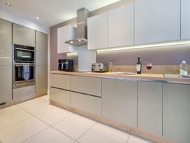 A kitchen with appliances and utensils at Rosemount Boutique in Windermere
