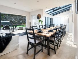 A dining room with a large table and chairs at Rosemount Boutique in Windermere