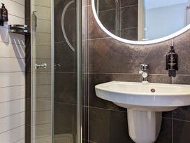A bathroom with a sink and shower at Rosemount Boutique in Windermere