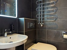 A bathroom with a sink and toilet at Rosemount Boutique in Windermere
