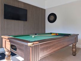A game room with a pool table and dartboard at Rosemount Boutique in Windermere