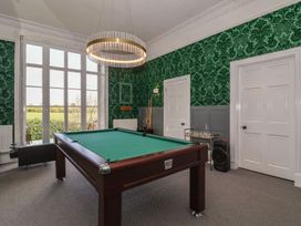 A room with a pool table a foosball table and a drinks trolley at Buckland House and Annex in Lower Durston near Taunton
