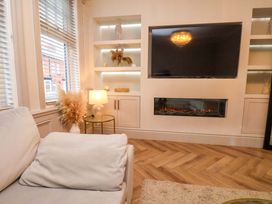 A living room with a television and fireplace at 59 Moorland Road Scarborough