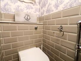 A bathroom with a toilet and towel holder at 59 Moorland Road Scarborough