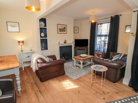 A living room with a sofa and coffee table at 1 Albion Place Whitby