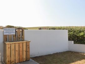 A beach wash station with taps at Jacana in Perranporth