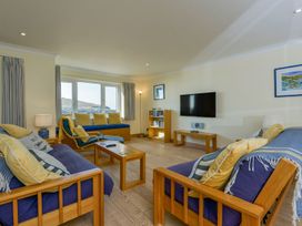 A living room with sofas and a television at Apartment 12, Burgh Island Causeway Bigbury-On-Sea