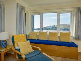 A living room with a window view and seating at Apartment 12, Burgh Island Causeway Bigbury-On-Sea