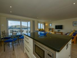 A kitchen and living area with a view at Apartment 12, Burgh Island Causeway Bigbury-On-Sea