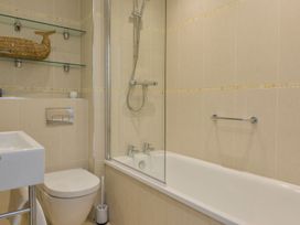 A bathroom with a bathtub and shower at Apartment 12, Burgh Island Causeway Bigbury-On-Sea