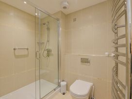 A bathroom with shower and toilet at Apartment 12, Burgh Island Causeway Bigbury-On-Sea