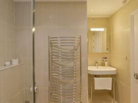 A bathroom with a towel radiator and sink at Apartment 12, Burgh Island Causeway, Bigbury-On-Sea