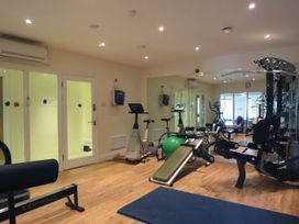 A gym with various exercise equipment at Apartment 12, Burgh Island Causeway Bigbury-On-Sea