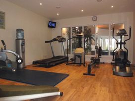 A gym with various exercise equipment at Apartment 12, Burgh Island Causeway Bigbury-On-Sea