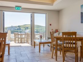 A dining room with tables and chairs at Apartment 12, Burgh Island Causeway Bigbury-On-Sea