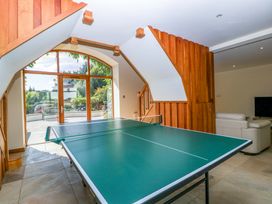 A recreation room with a ping pong table at Heathcliffe House, Caslteton near Cardiff