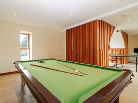 A games room with a pool table and a window at Heathcliffe House in Castledon near Cardiff