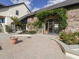 An outdoor area with a planter and stone wall at Heathcliffe House Caslteton near Cardiff