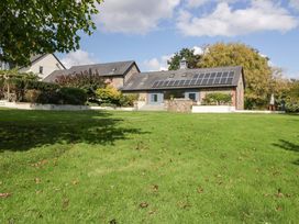 A house with solar panels and a garden at Heathcliffe House in Castleton near Cardiff