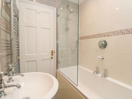 A bathroom with a shower and sink at 23 Carncrows Street St Ives