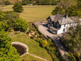 An outdoor view of a house and garden at Leathes Head Country House Borrowdale near Keswick
