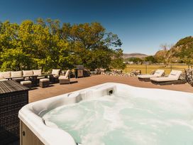 An outdoor space with a hot tub and seating area at Leathes Head Country House in Borrowdale near Keswick