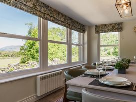 A dining room with a table set for dinner at Leathes Head Country House Borrowdale near Keswick