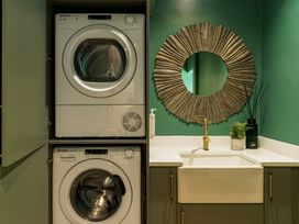 A laundry room with a washing machine and dryer at Leathes Head Country House in Borrowdale near Keswick