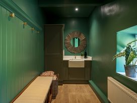 A bathroom with a sink and a mirror at Leathes Head Country House Borrowdale near Keswick