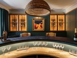 A bar area with bottles and glasses at Leathes Head Country House in Borrowdale near Keswick
