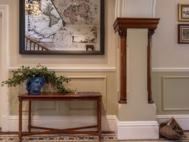 A hallway with a table and a decorative vase at Leathes Head Country House, Borrowdale near Keswick