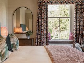 A bedroom with a bed and window at Leathes Head Country House in Borrowdale near Keswick
