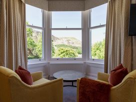 A sitting room with a view and furniture at Leathes Head Country House in Borrowdale near Keswick