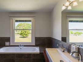 A bathroom with a bathtub and sink at Leathes Head Country House Borrowdale near Keswick