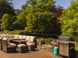 An outdoor seating area with a barbecue grill at Leathes Head Country House in Borrowdale near Keswick