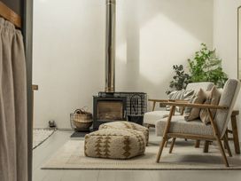 A living room with furniture and plants at Grove Cottage Kington