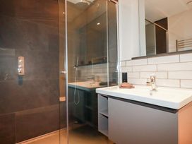 A bathroom with a shower and sink at Harberton